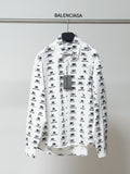 White long-sleeve shirt with black logo pattern, button-front, spread collar.
