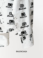 White long-sleeve shirt hem with black Balenciaga monogram print