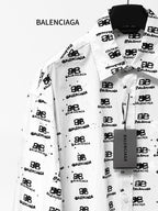 White long-sleeve shirt with black logo icon and text pattern, button-front.