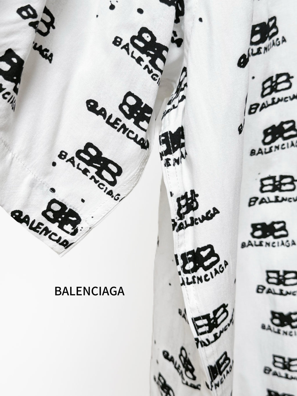 Balenciaga long-sleeve shirt sleeve close-up in white with black logo print
