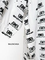 Balenciaga long-sleeve shirt sleeve close-up in white with black logo print