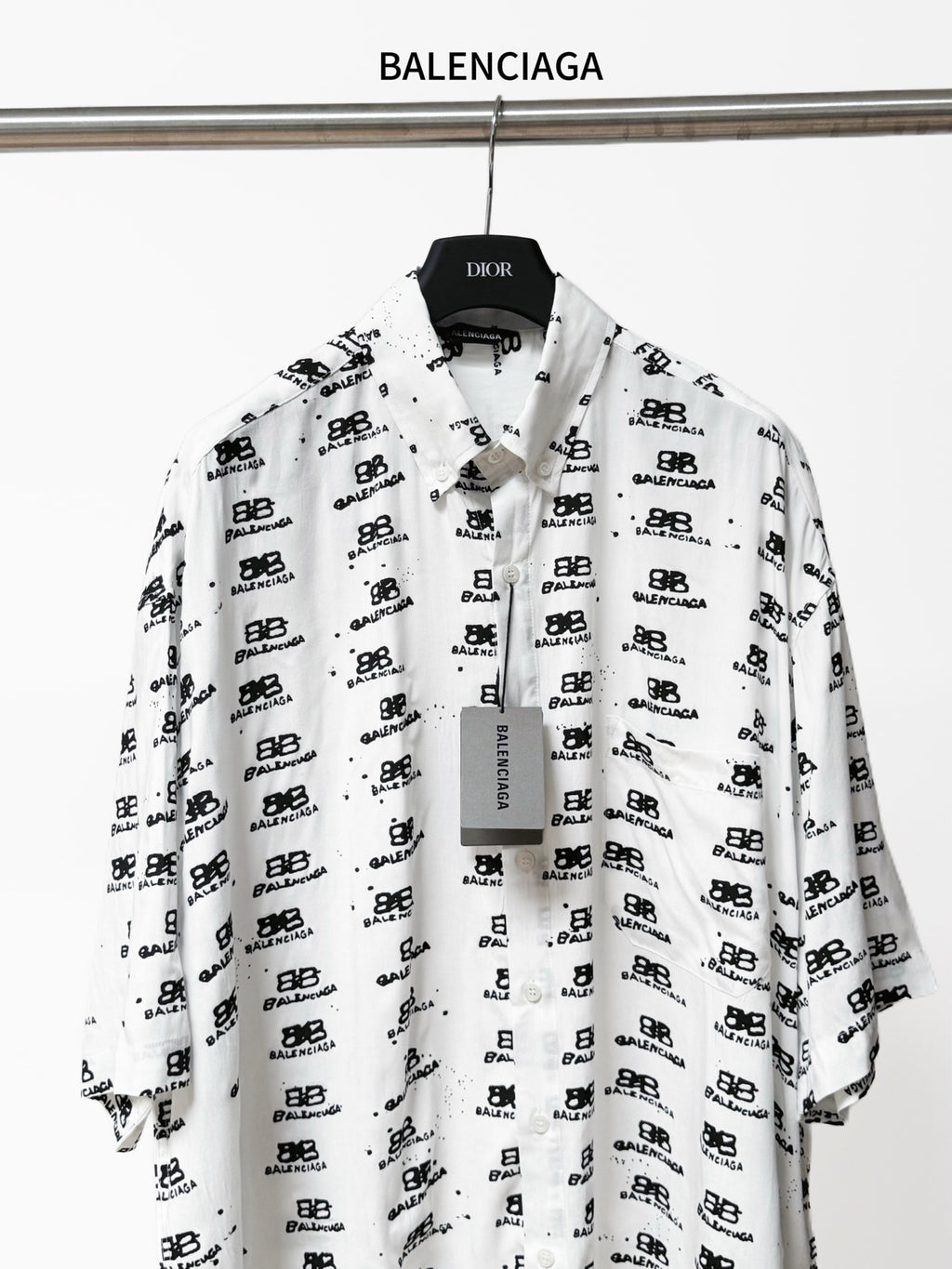 Balenciaga long-sleeve shirt in white with black repeating logo print, button placket