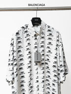 Balenciaga long-sleeve shirt in white with black repeating logo print, button placket