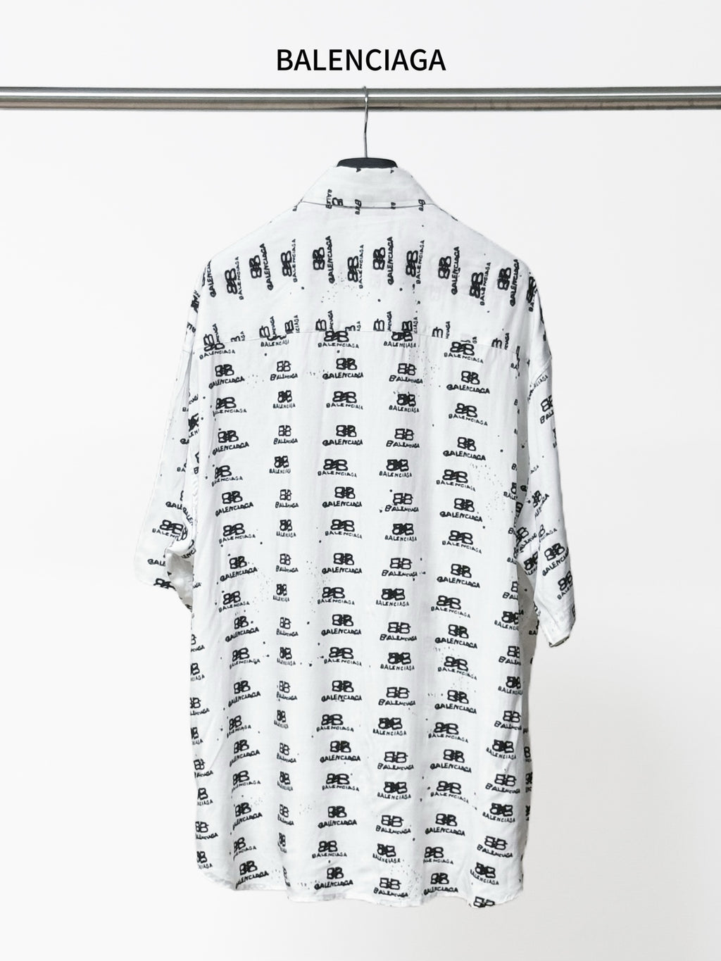 Balenciaga long-sleeve shirt back view in white with black all-over logo pattern
