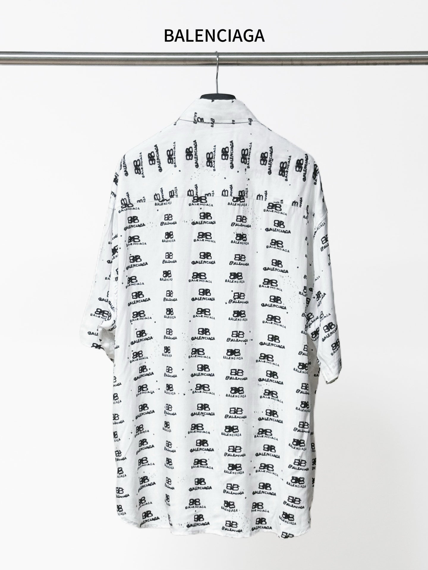 Balenciaga long-sleeve shirt back view in white with black all-over logo pattern