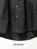Balenciaga black long-sleeve button-up shirt close-up of button placket at front