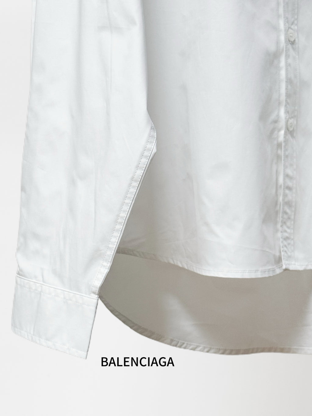 Balenciaga white long-sleeve shirt with straight hem and visible side seams