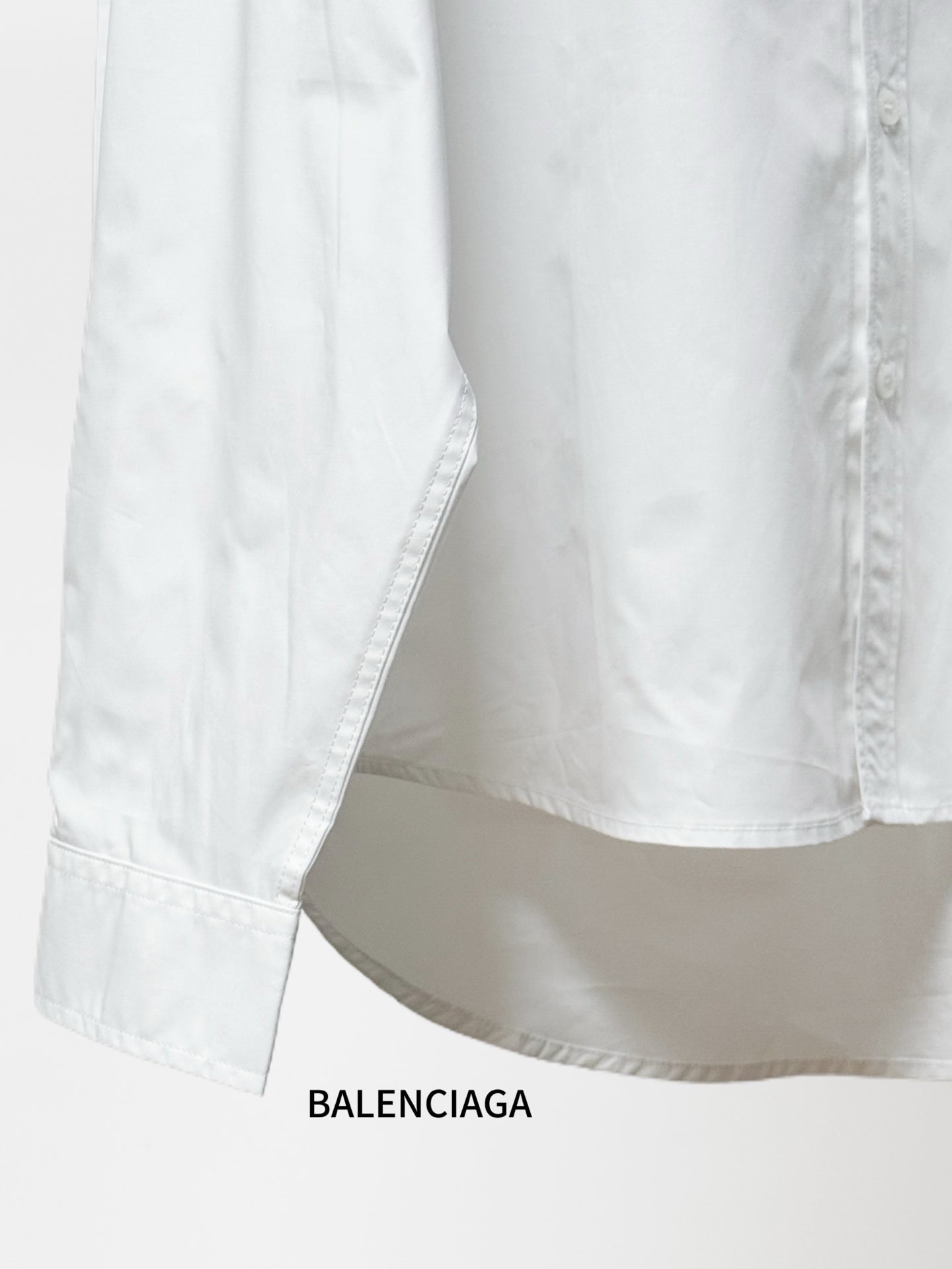 Balenciaga white long-sleeve shirt with straight hem and visible side seams