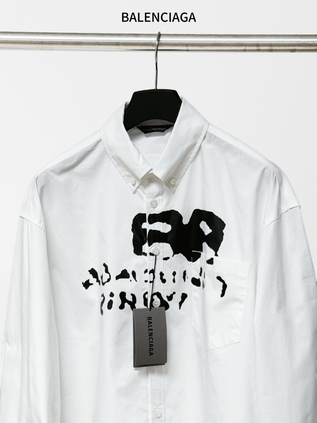 Balenciaga white button-up long-sleeve shirt with large black logo graphic