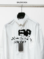 White Balenciaga button-up shirt close-up of front black graphic and tag