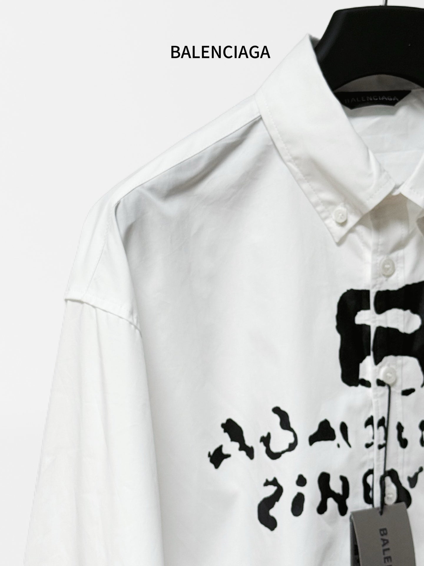 Balenciaga white long-sleeve shirt with partial black logo print at chest