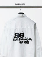 Balenciaga white button-up long-sleeve shirt with centered black 'BALENCIAGA PARIS' print