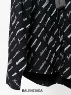 Long-sleeve shirt with allover white logo print, curved vented hem