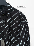 Black long-sleeve button-up shirt with repeating white script logo pattern, chest and placket