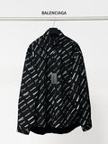 Black long-sleeve button-up shirt with repeating white script logo pattern and collar