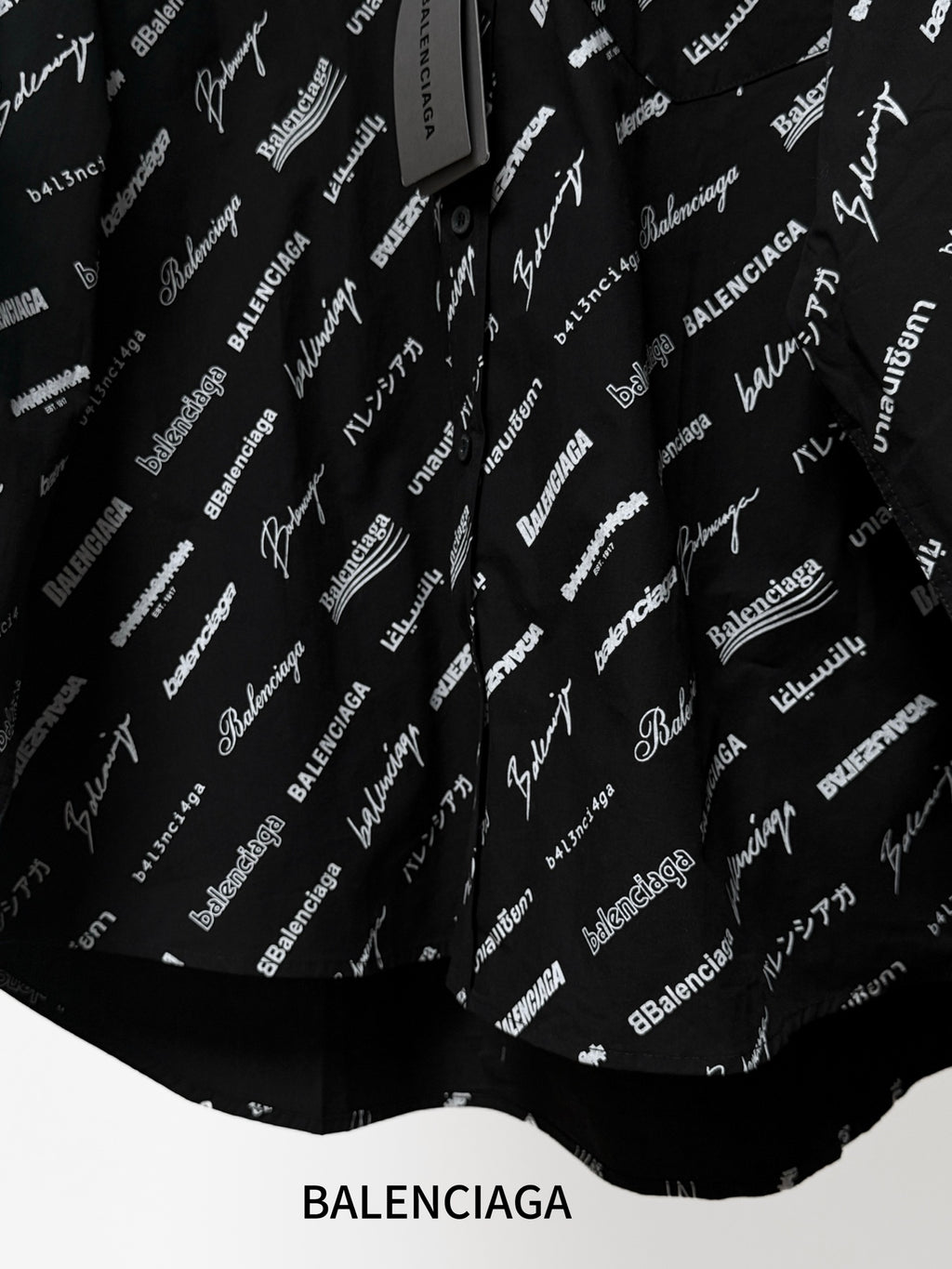 Long-sleeve shirt with allover white logo print, curved hem and buttons
