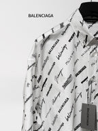 White long-sleeve shirt with black Balenciaga print, shown from shoulder and sleeve