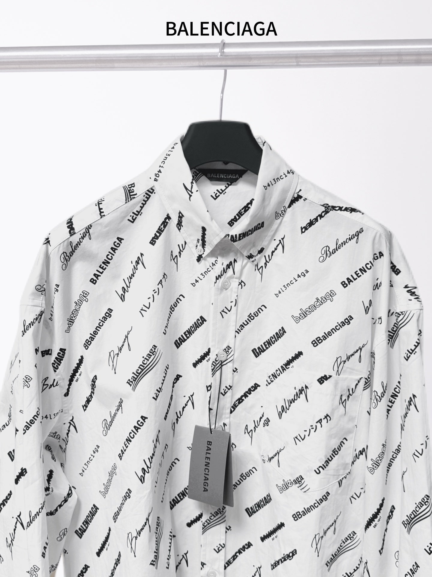 White logo-print long-sleeve button-up shirt with pointed collar and central placket