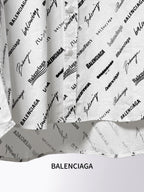 White shirt lower section with black Balenciaga script print and folded fabric