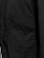 Balenciaga long-sleeve shirt, black, close-up of front chest pocket.