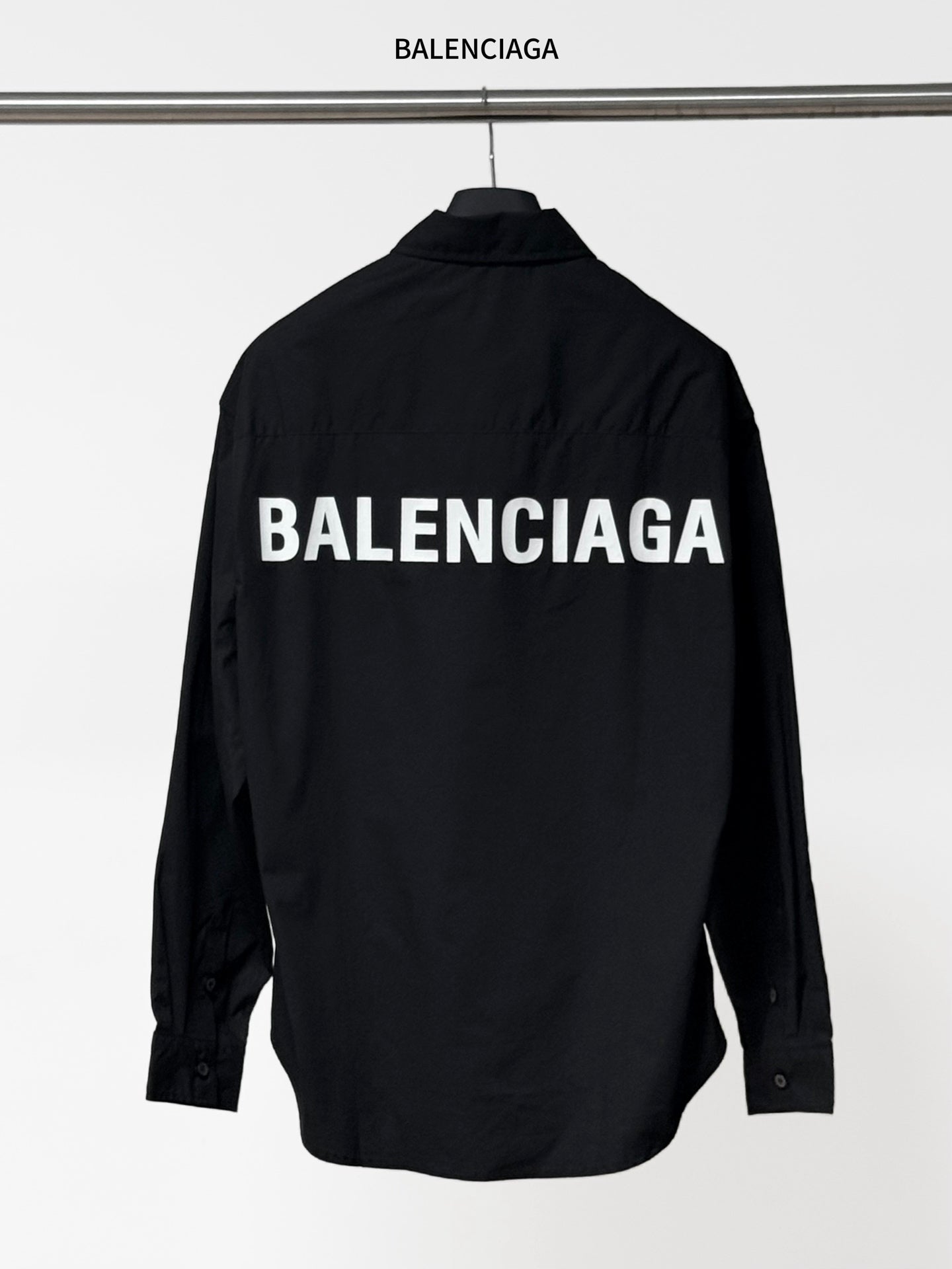 Long-sleeve button-up shirt by Balenciaga, dark black, back view with BALENCIAGA print.