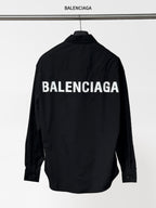 Balenciaga long-sleeve button-up shirt, black, with BALENCIAGA logo on back.