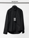 Long-sleeve button-up shirt by Balenciaga, dark black, front view with button placket.