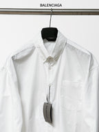 Balenciaga long-sleeve button-up shirt, white, front placket and chest pocket.
