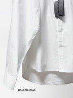 Balenciaga long-sleeve button-up shirt, white, side view with buttoned front.