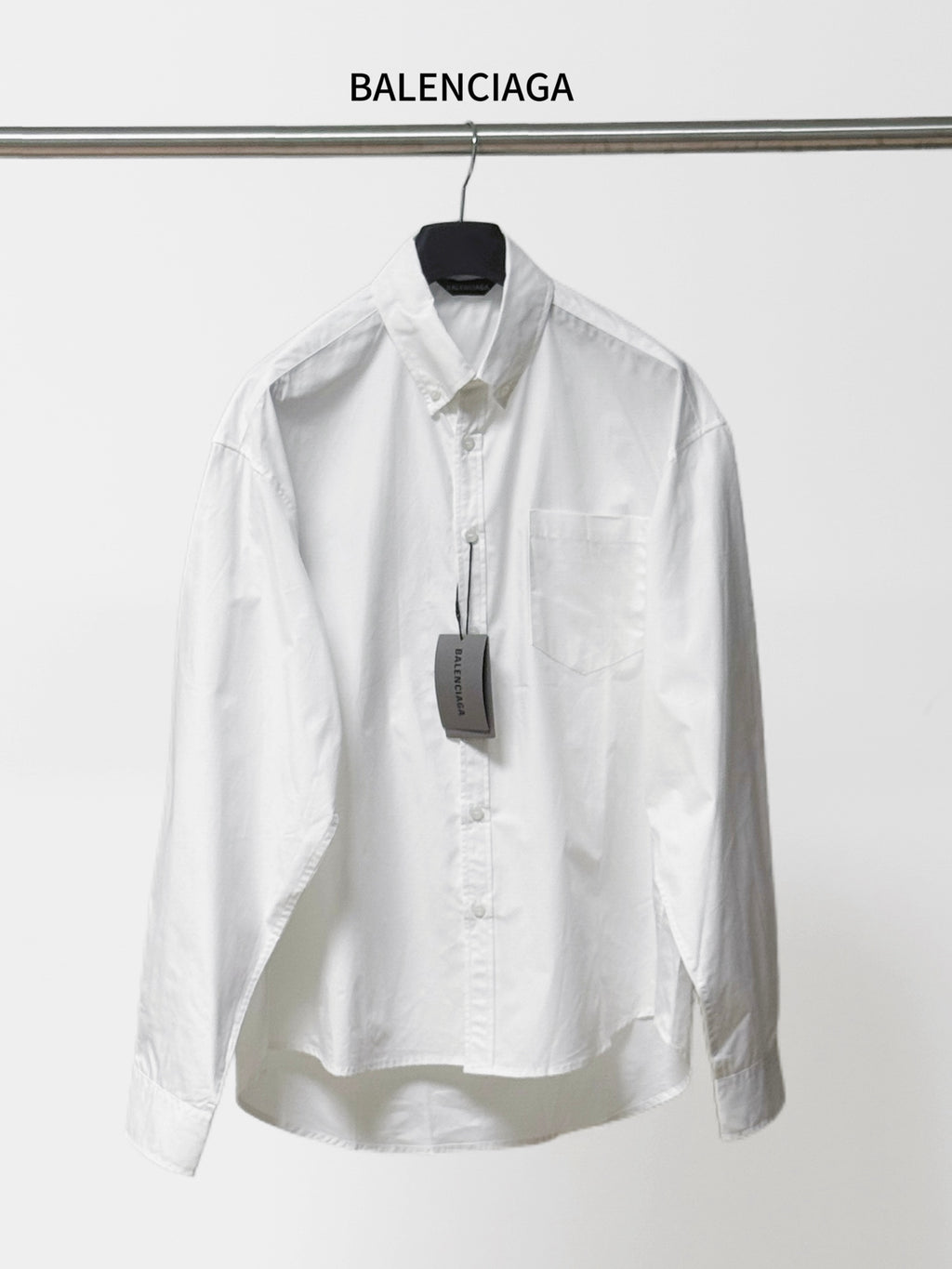 Balenciaga long-sleeve button-up shirt, white, pointed collar and chest pocket.