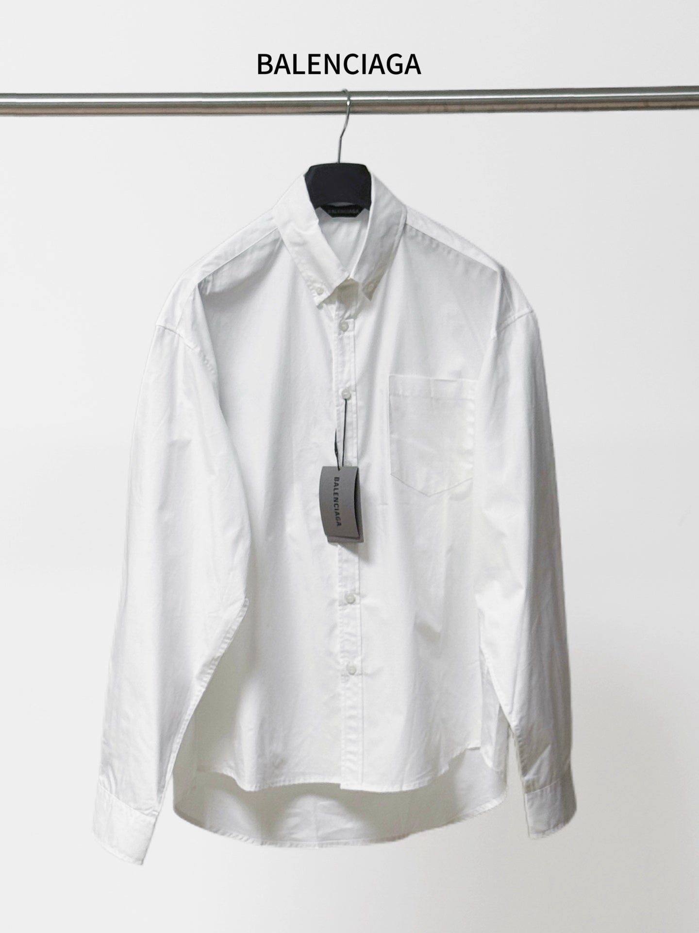 Balenciaga long-sleeve button-up shirt, white, pointed collar and chest pocket.