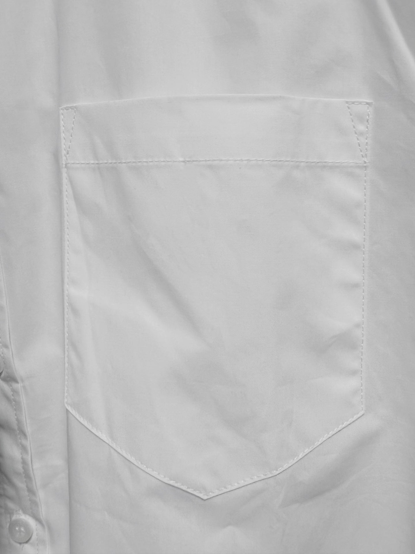 Balenciaga long-sleeve button-up shirt, white, chest pocket close-up with stitched edges.