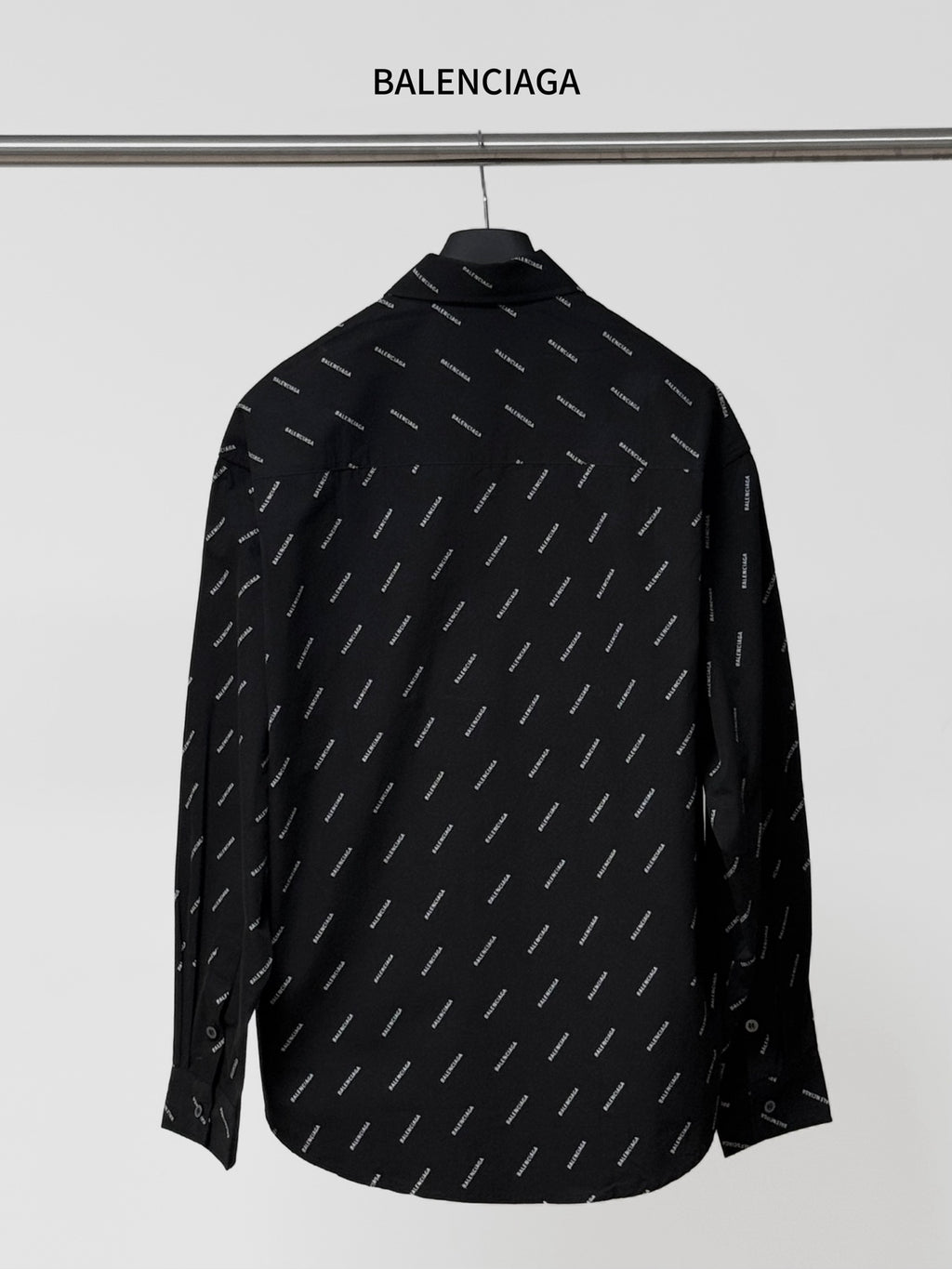 Balenciaga long-sleeve shirt, back view in black with repeating logo pattern