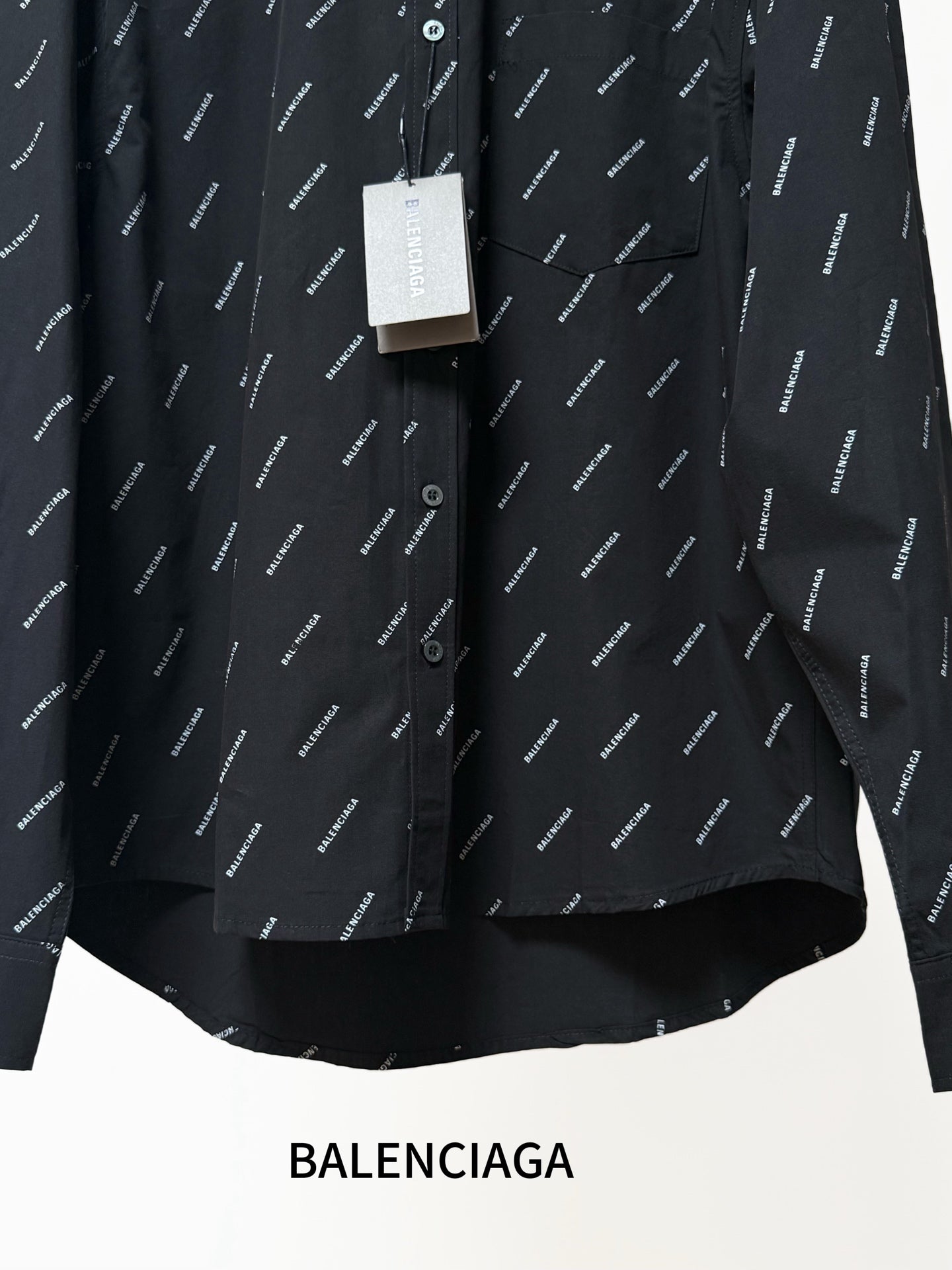 Balenciaga long-sleeve shirt front detail, black logo pattern, button placket and cuffs
