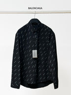 Balenciaga long-sleeve shirt in black with allover logo print and button collar