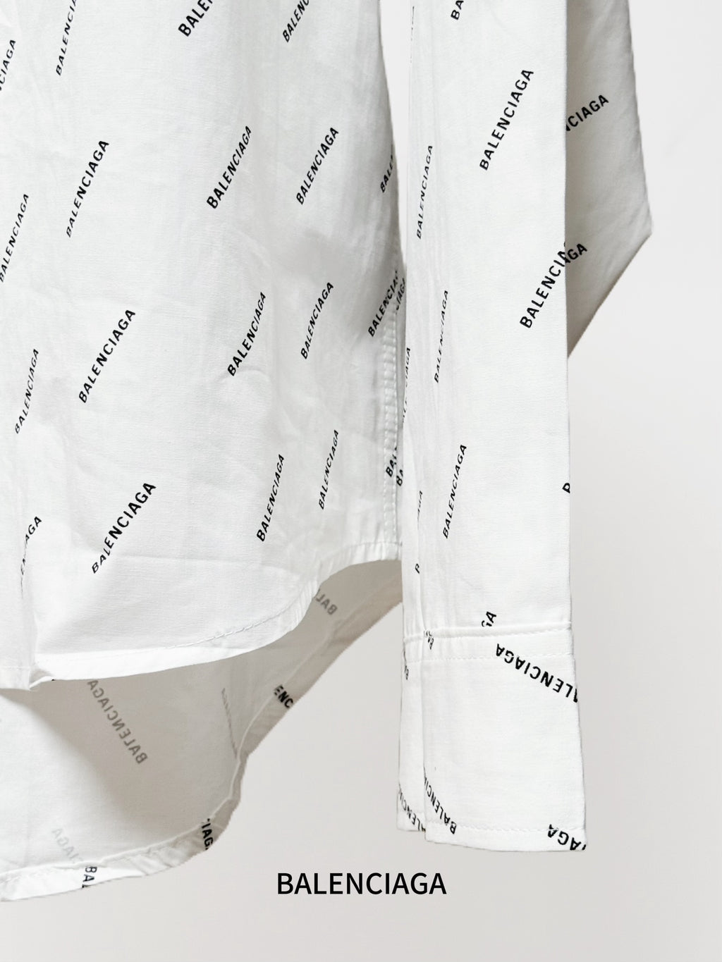 Long-sleeve shirt side seam and cuff with allover black logo print