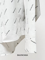 Long-sleeve shirt side seam and cuff with allover black logo print