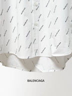 Long-sleeve shirt lower hem with allover black logo print and curved bottom edge