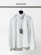 Long-sleeve button-up shirt with allover black logo pattern, pointed collar and front buttons