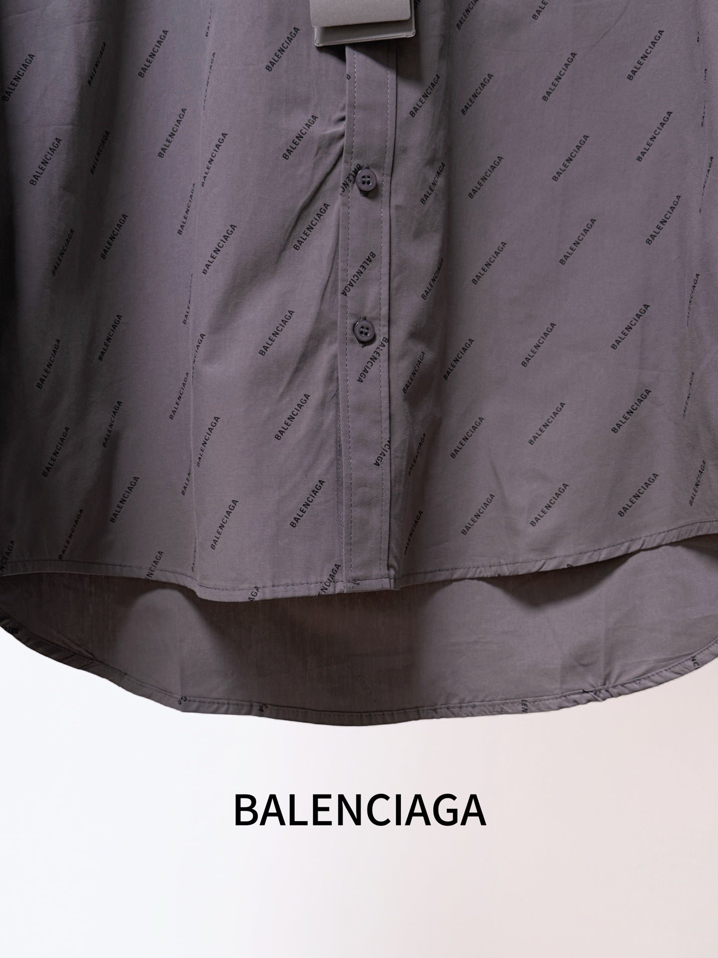 Balenciaga long-sleeve button-up shirt front, gray with button placket and curved hem