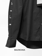 Black long-sleeve button-up shirt cuff detail with small allover Balenciaga markings