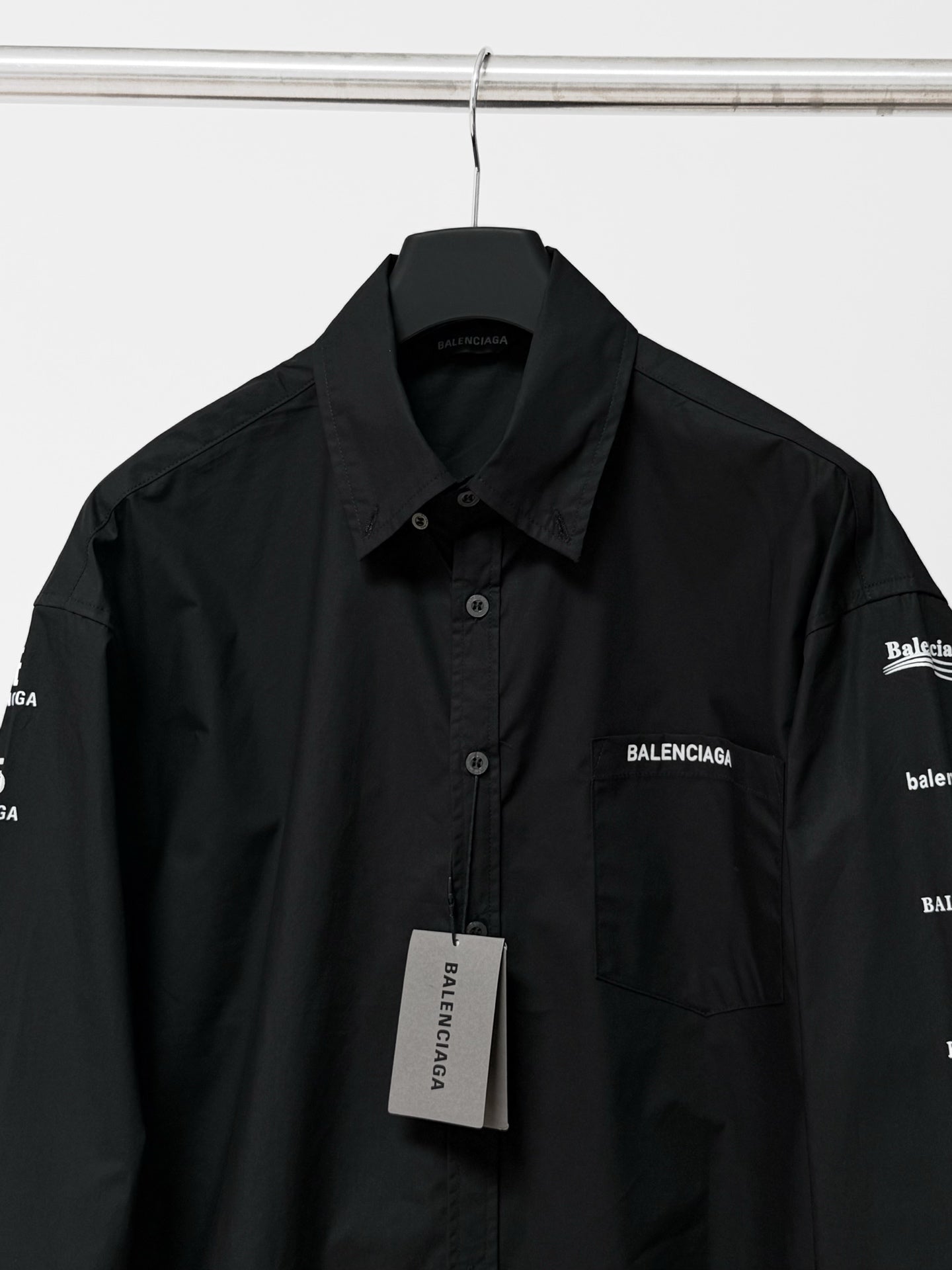 Black long-sleeve button-up shirt with Balenciaga chest logo, collar, and hangtag