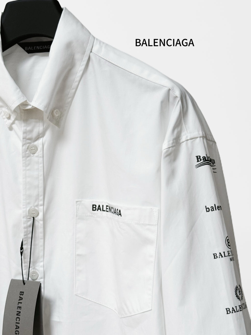 White Balenciaga button-up shirt with chest pocket and right sleeve logo print