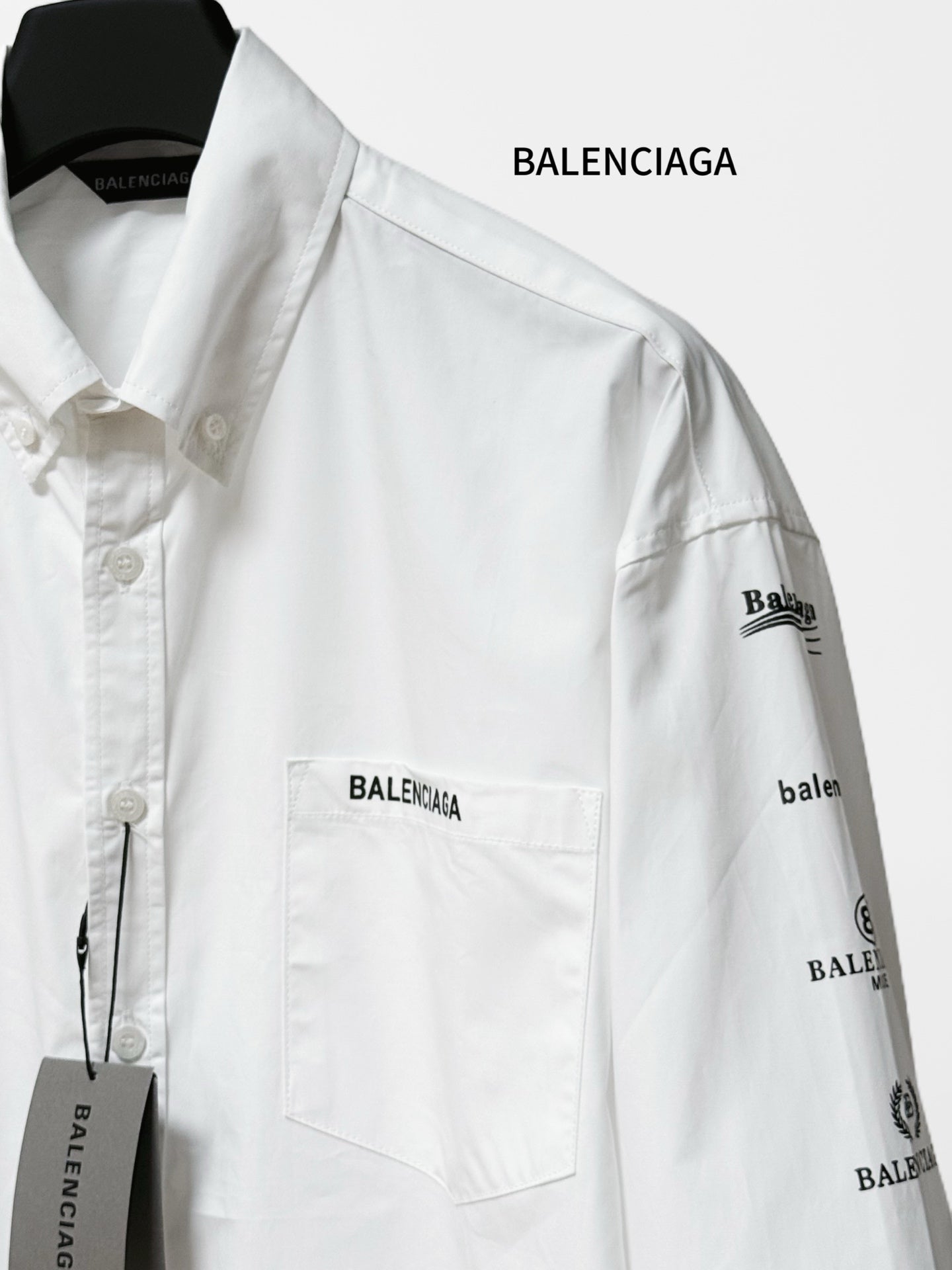 White Balenciaga button-up shirt with chest pocket and right sleeve logo print
