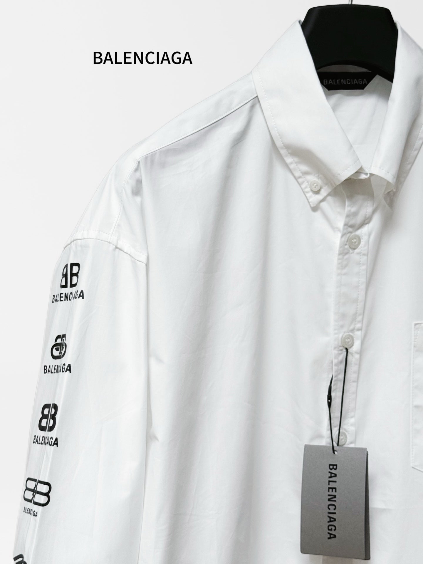 White Balenciaga button-up shirt with logo print sleeve and chest pocket