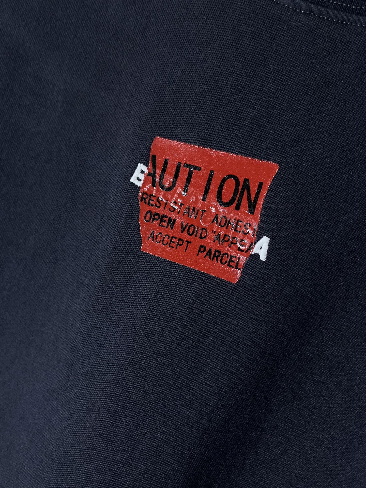 Navy T-shirt with close-up red square logo graphic print
