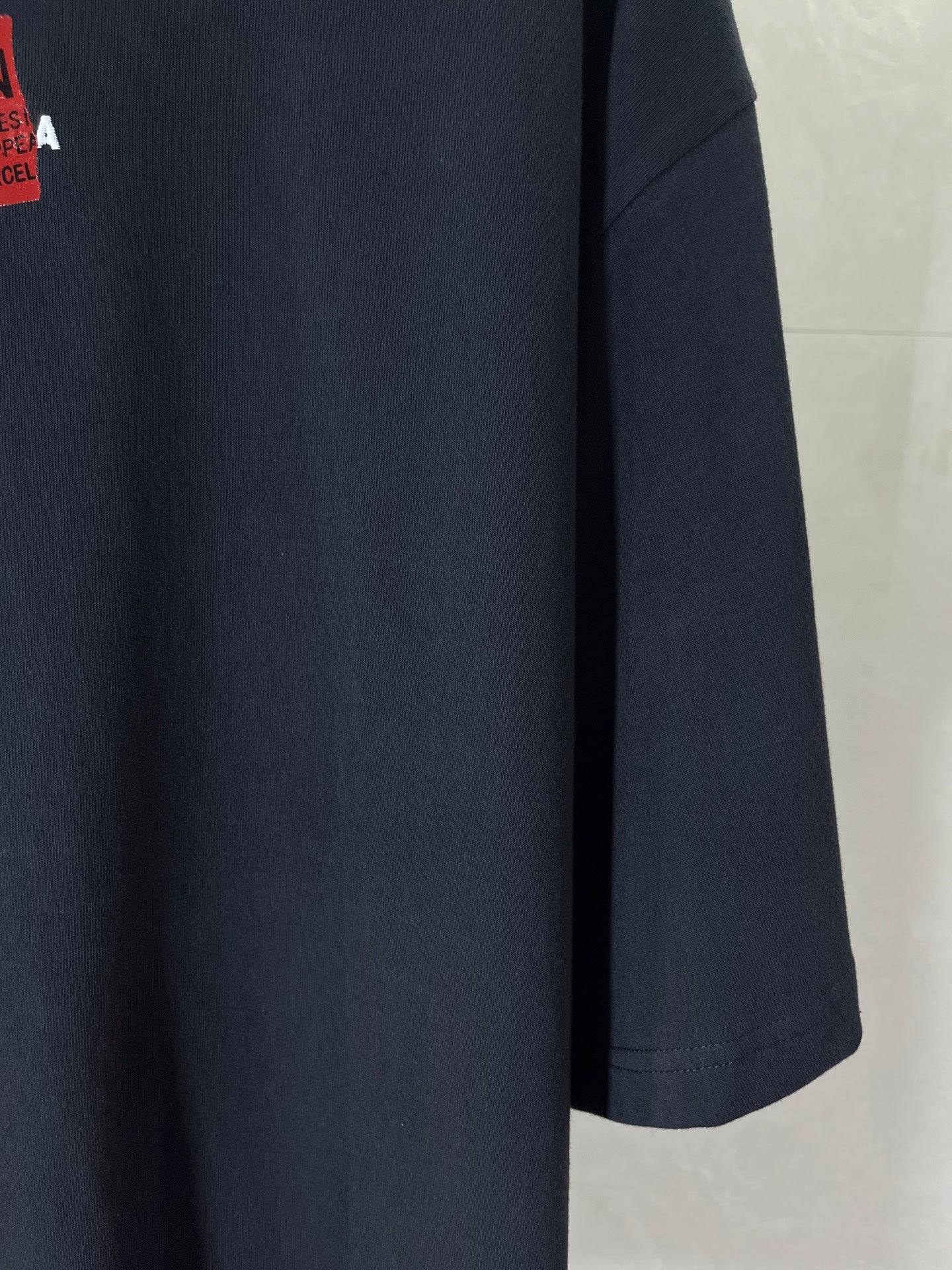 Navy short-sleeve T-shirt with visible side and hem stitching