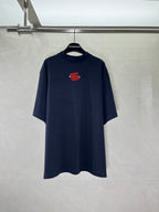 Navy short-sleeve crewneck T-shirt with small red graphic print on chest