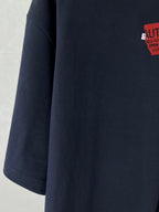 Navy short-sleeve T-shirt sleeve and side panel seam detail