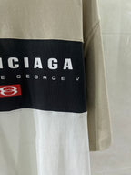 Balenciaga logo T-shirt side detail, black band with brand text and red patch